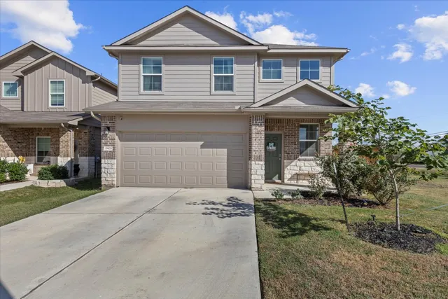front view of a house with a yard