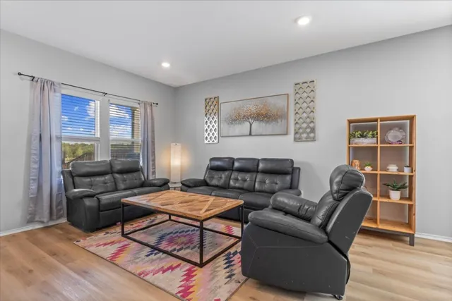 a living room with furniture and a window