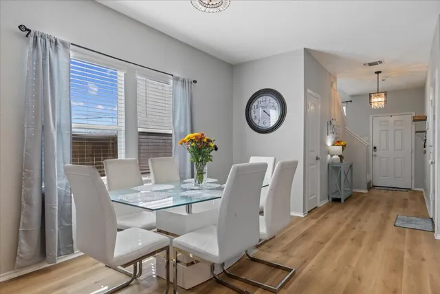 a large kitchen with a table and chairs in it