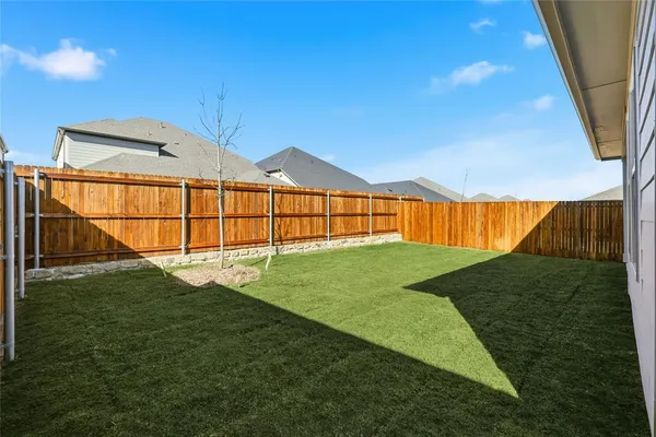 a view of a backyard with a garden and plants
