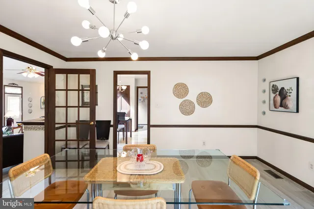 a view of staircase with railing and white walls