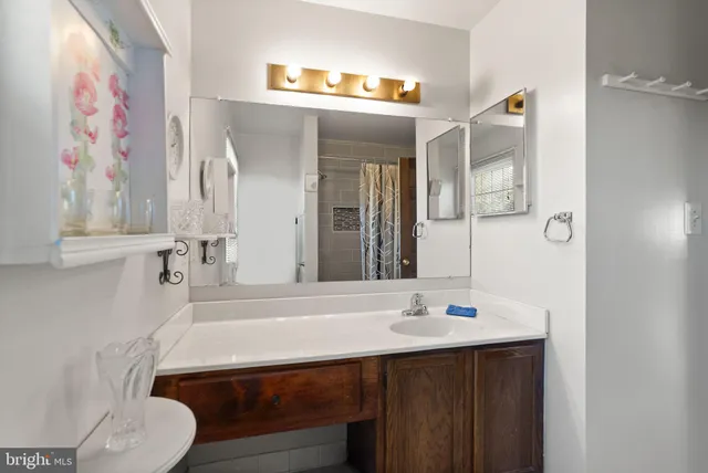 a bedroom with a bed and a dresser in it