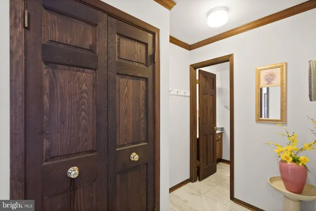 a view of a livingroom with furniture and a window
