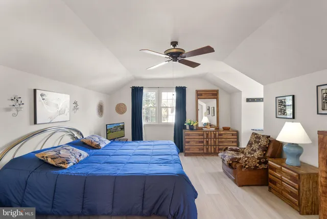 a view of a house with a yard porch and sitting area