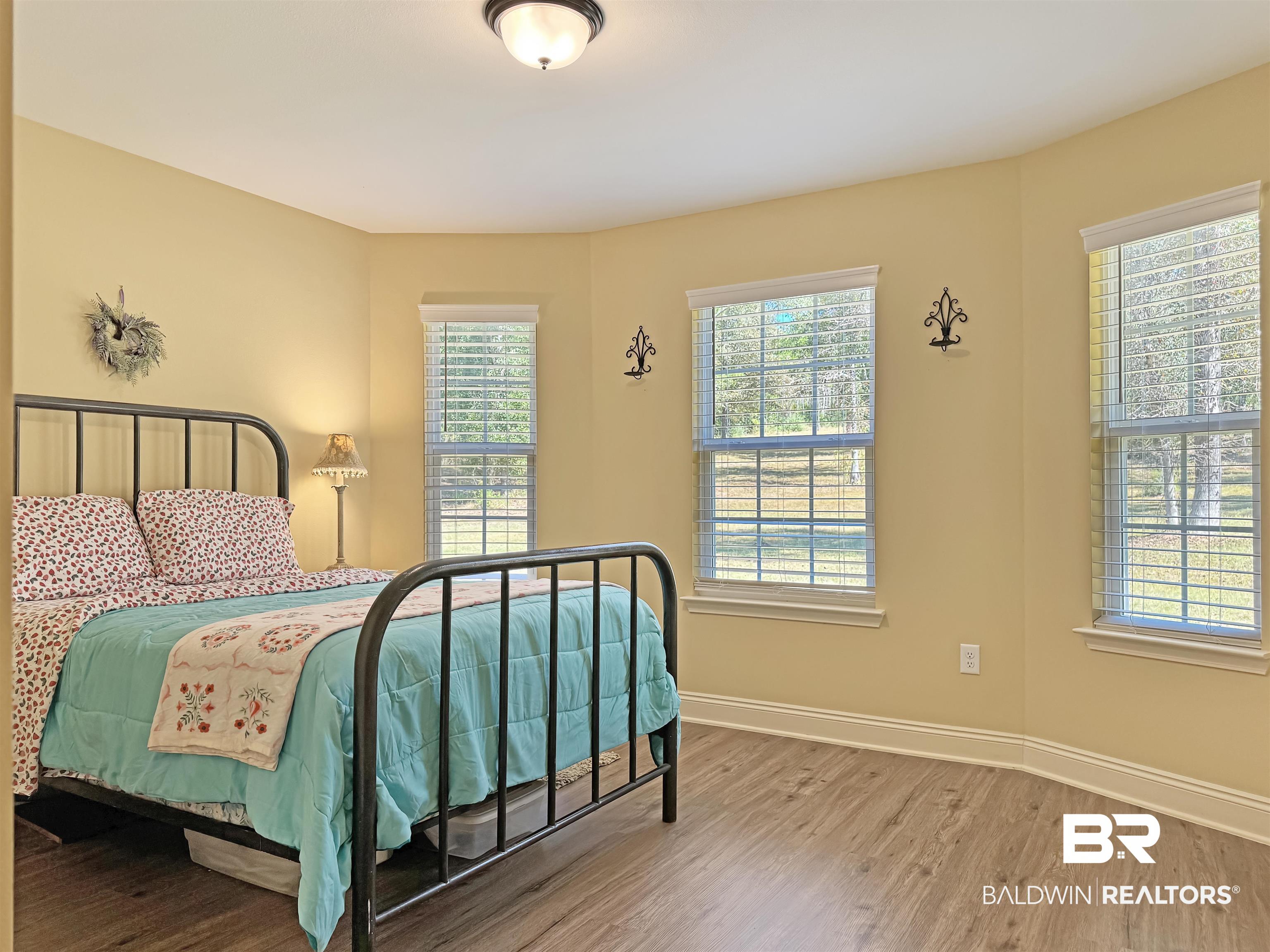 30687 Brady Road Robertsdale, AL 36567 - Photo 26 of 53 A beautiful wall of windows provide abundant light in this room.