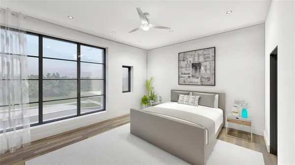 a room with a bed and a large window