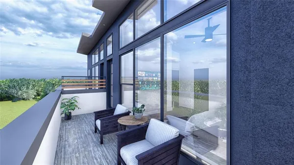 a view of balcony with furniture