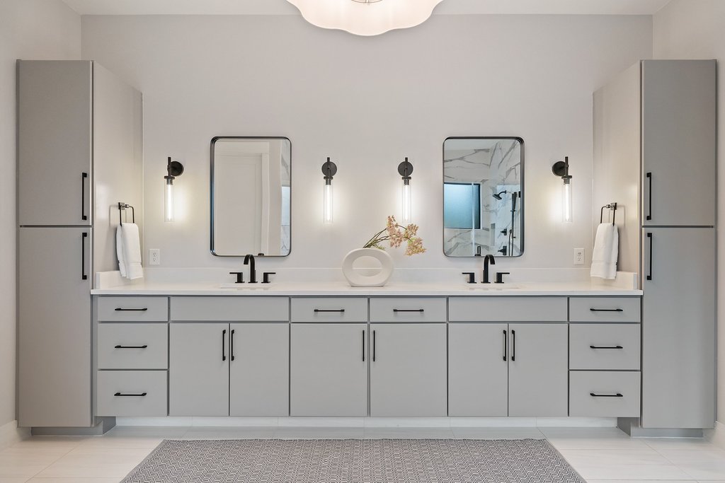 5405 Montview Street Austin, TX 78756 - Photo 20 of 40 The dual vanity is framed by linen cabinets, creating an intention, functional, and balanced design.