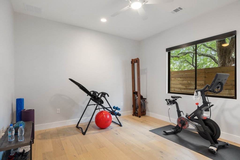 5405 Montview Street Austin, TX 78756 - Photo 22 of 40 A second main-floor bedroom with its own ensuite offers flexibility for guests, a home office, or exercise room.