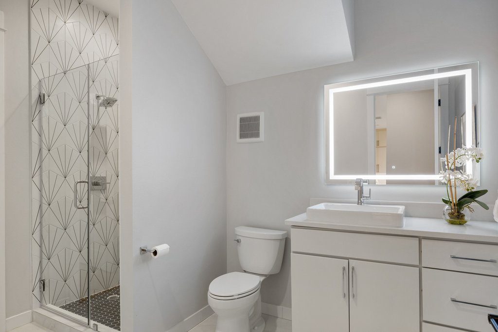 5405 Montview Street Austin, TX 78756 - Photo 24 of 40 Bedroom 3 offers access to a full bath with a walk-in shower.