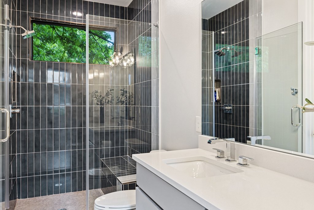 5405 Montview Street Austin, TX 78756 - Photo 29 of 40 The 4th full bath offers a walk-in shower and a window for natural light.
