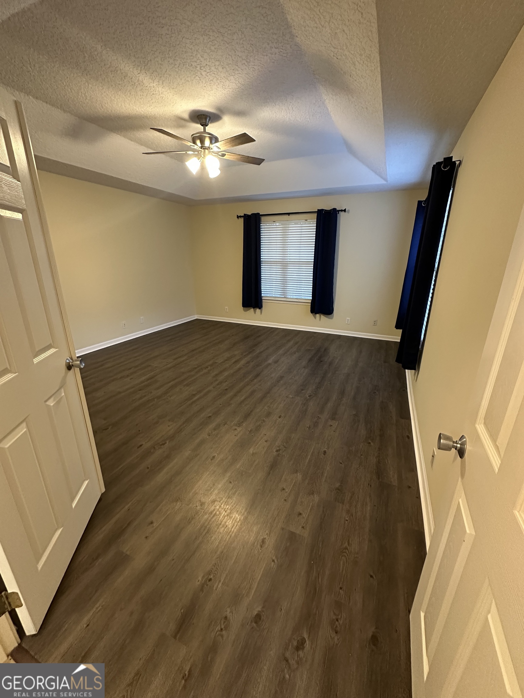1024 Greenwillow Drive St. Marys, GA 31558 - Photo 15 of 35 a view of an empty room with wooden floor and a window