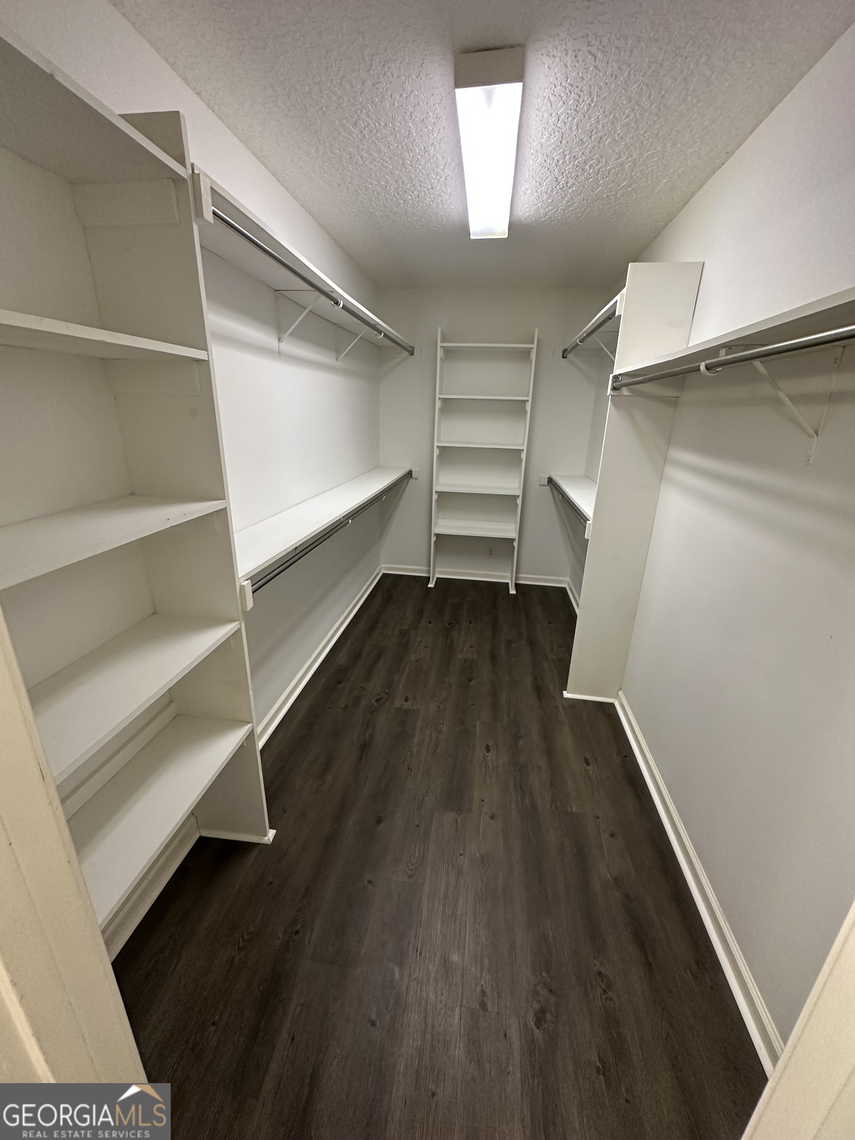 1024 Greenwillow Drive St. Marys, GA 31558 - Photo 18 of 35 a view of walk in closet with empty racks