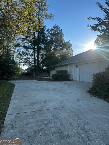 a view of a house with a yard and garage