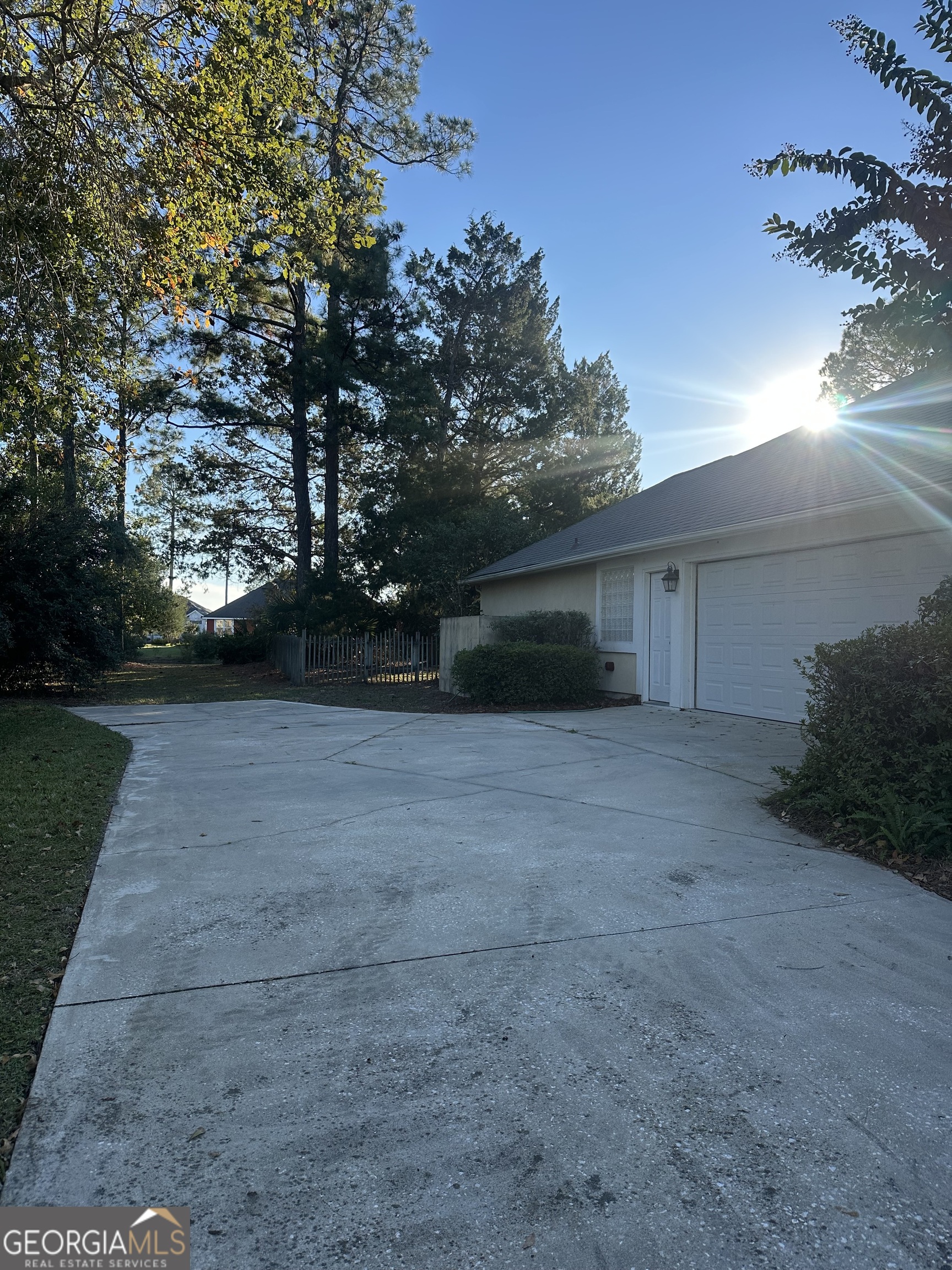 1024 Greenwillow Drive St. Marys, GA 31558 - Photo 2 of 35 a view of a house with a yard and garage