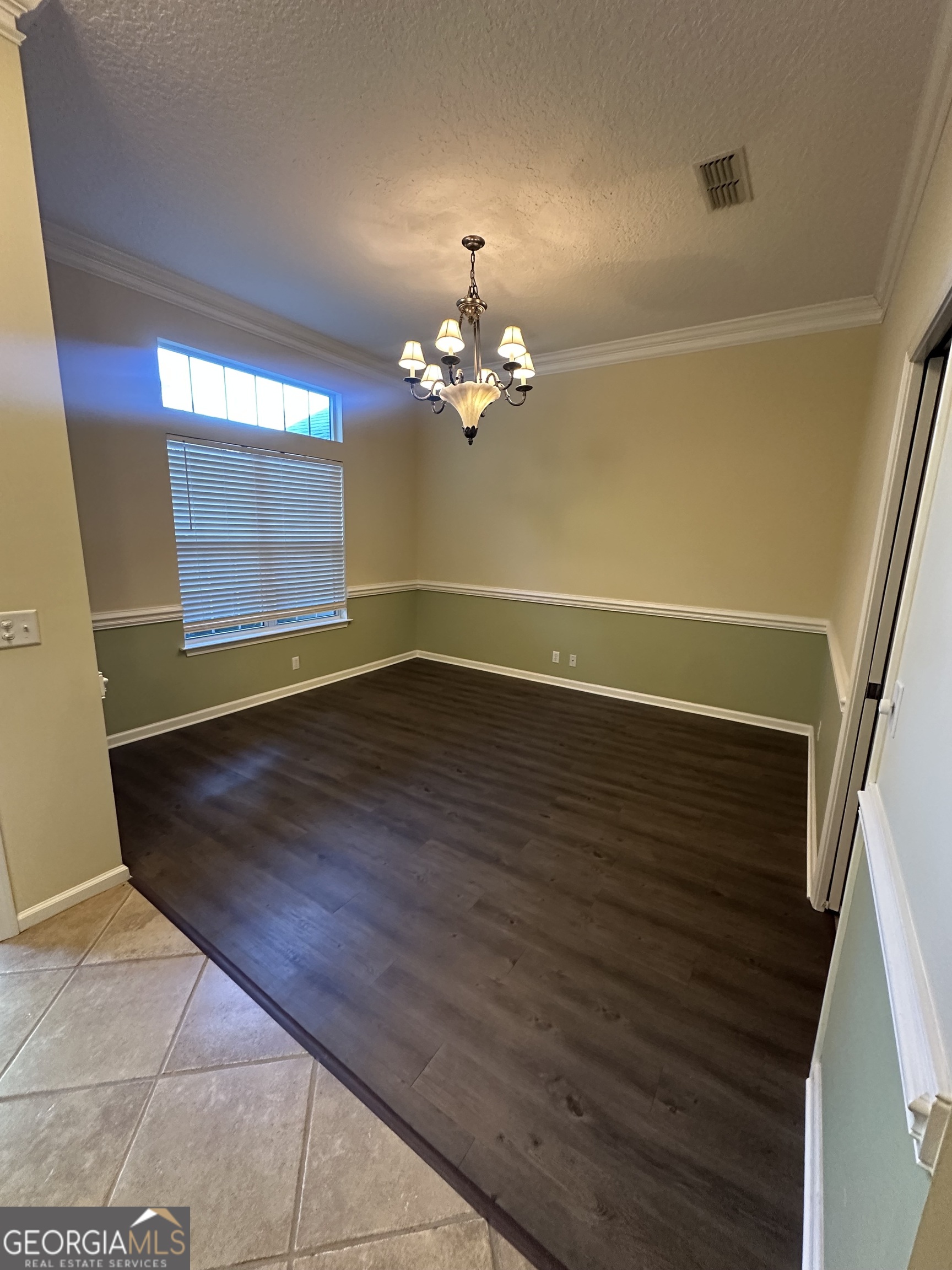 1024 Greenwillow Drive St. Marys, GA 31558 - Photo 6 of 35 a view of a room with wooden floor and chandelier