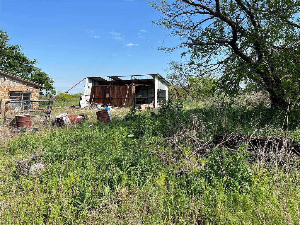 9315 Highway 79 Wichita Falls, TX 76310 - Photo 29 of 29 View of yard with an outdoor structure