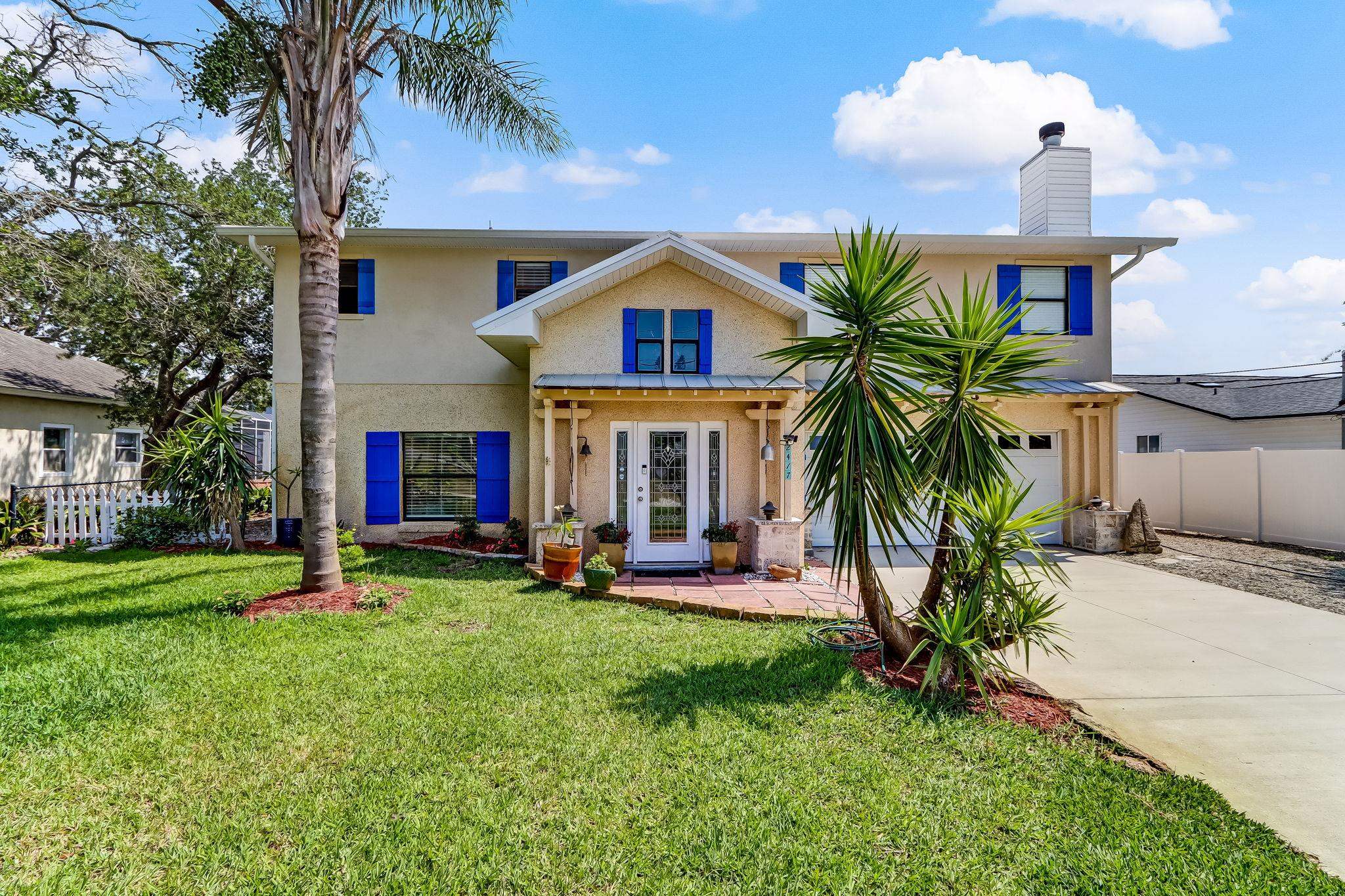 247 Treasure Beach Road St. Augustine, FL 32080 - Photo 1 of 28 a front view of house with yard and green space
