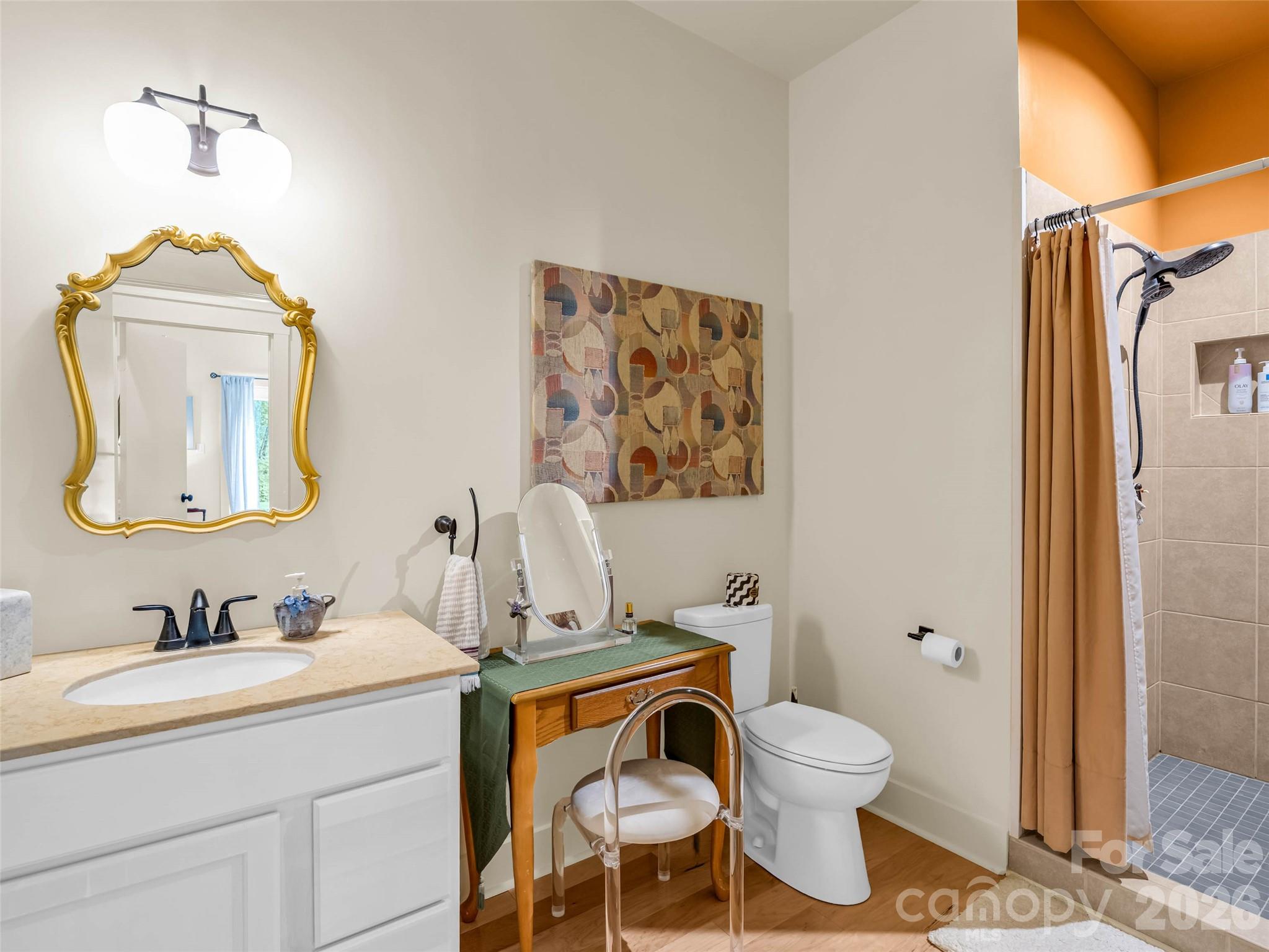 120 Glenn Court Mill Spring, NC 28756 - Photo 41 of 48 a bathroom with a toilet sink and mirror