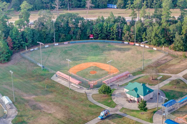 an aerial view of a house with a lake view