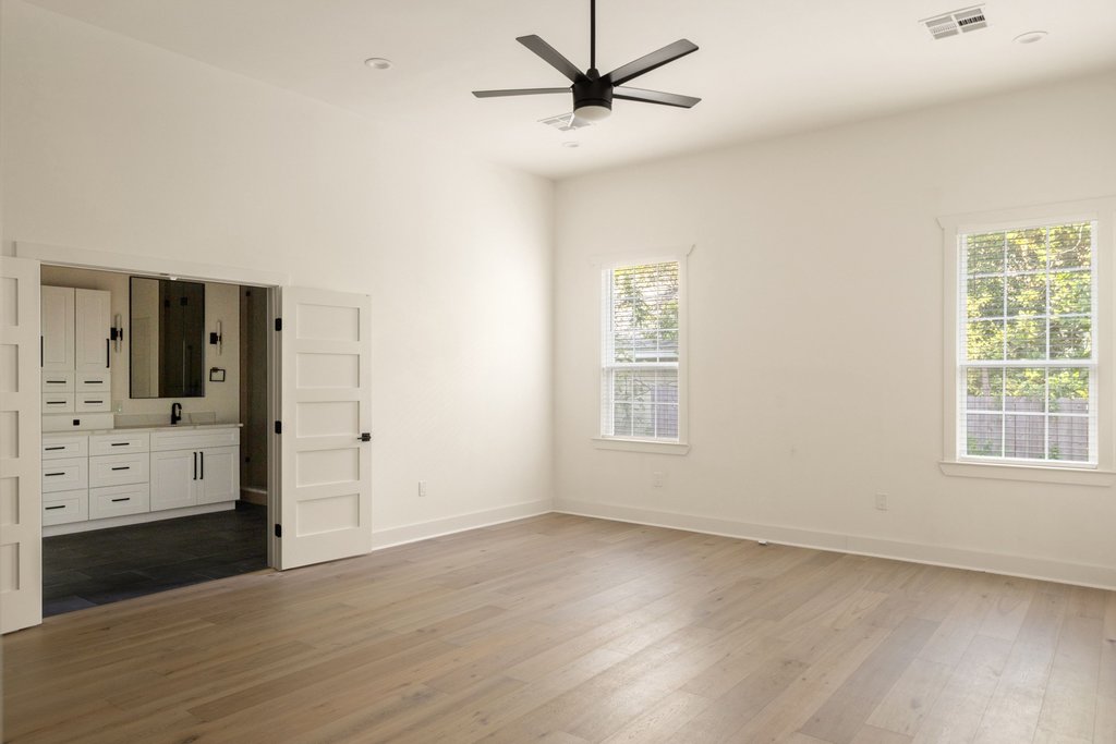 Undisclosed Address Austin, TX 78751 - Photo 9 of 20 The primary suite offers an elegant space to retreat, complete with a spa-inspired ensuite.