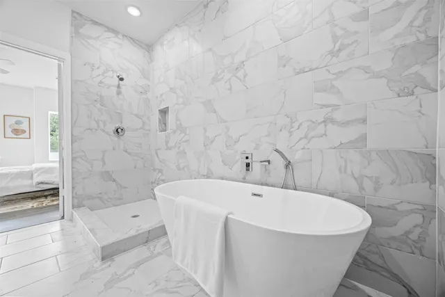 a bathroom with a toilet and a shower