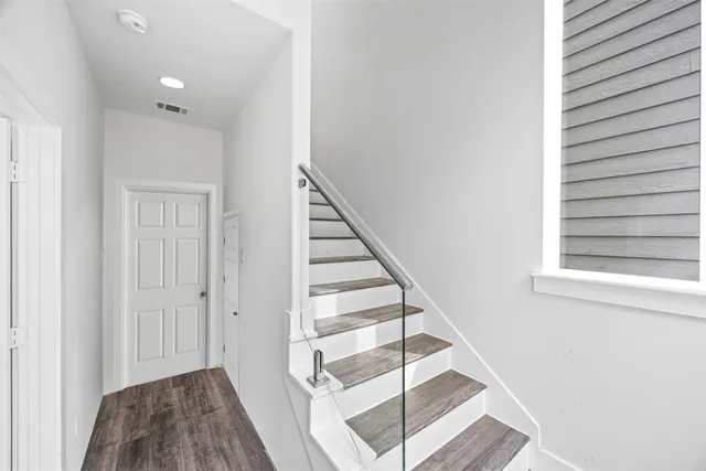 a view of a hallway with staircase