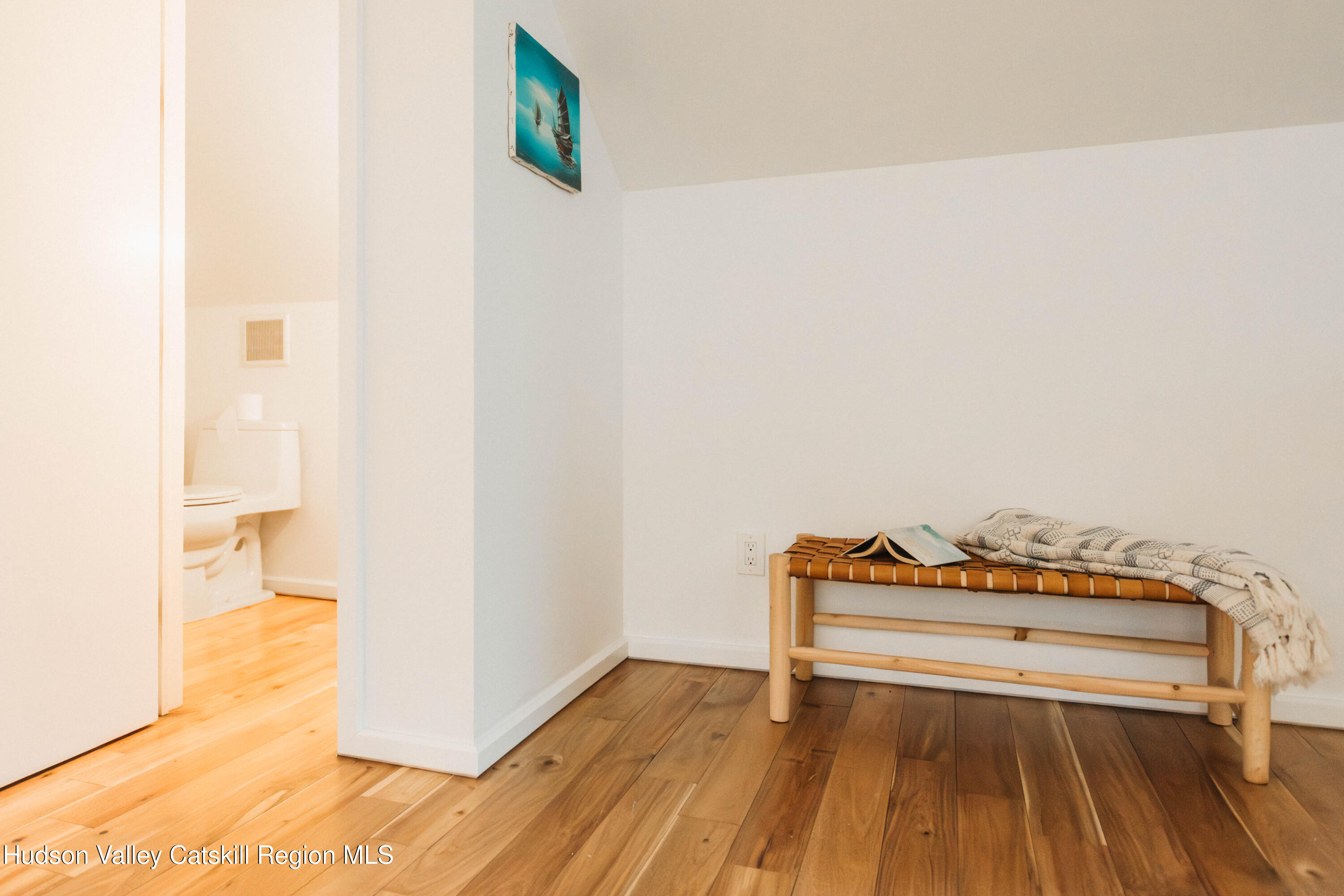 675 Cooper Lake Road Woodstock, NY 12448 - Photo 19 of 31 a view of a room with wooden floor and bench