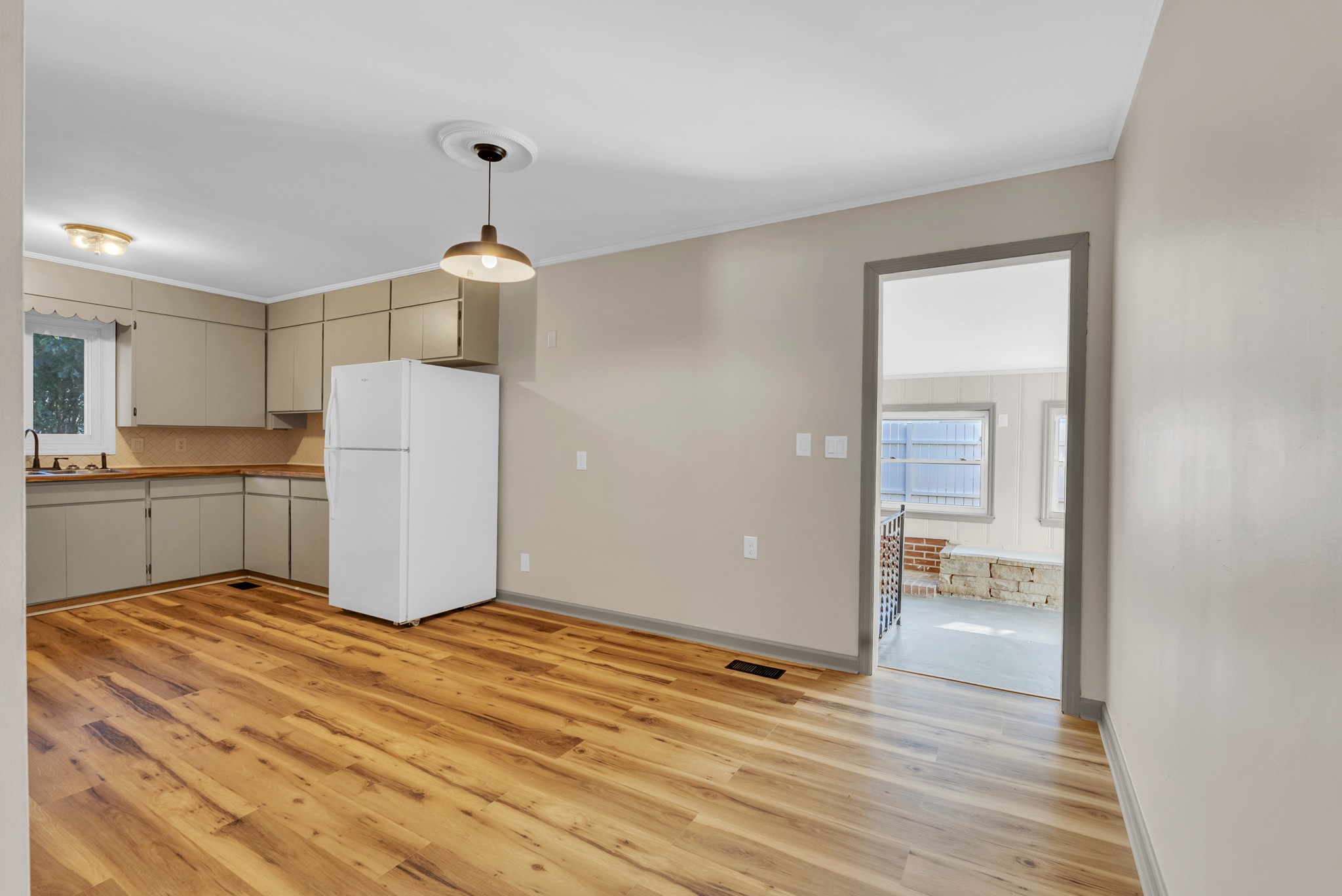107 Oak Street Sparta, TN 38583 - Photo 12 of 26 a view of a kitchen with a sink and a refrigerator