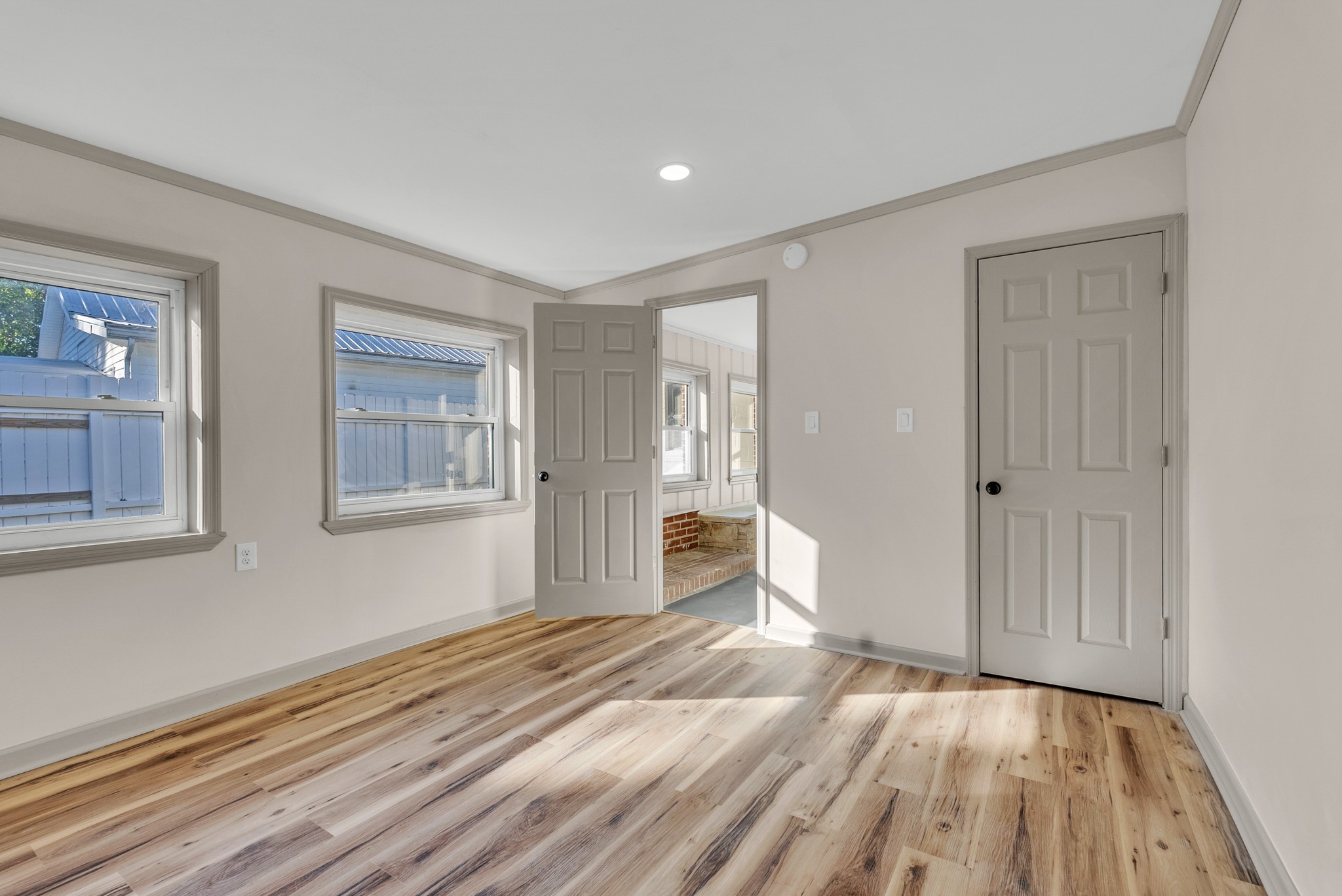 107 Oak Street Sparta, TN 38583 - Photo 16 of 26 a view of a livingroom with wooden floor and a bathroom