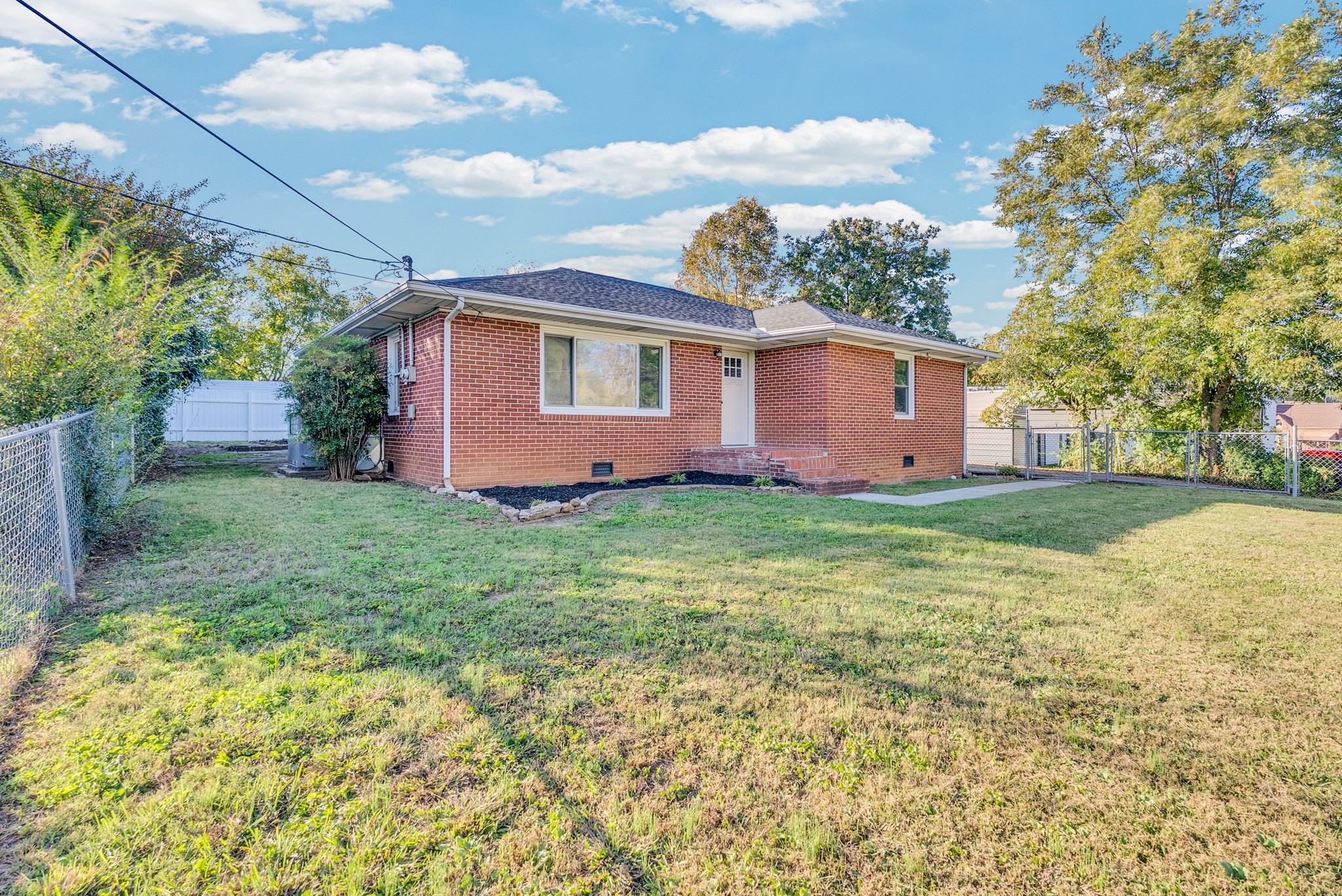 107 Oak Street Sparta, TN 38583 - Photo 17 of 26 a front view of house with yard and trees around