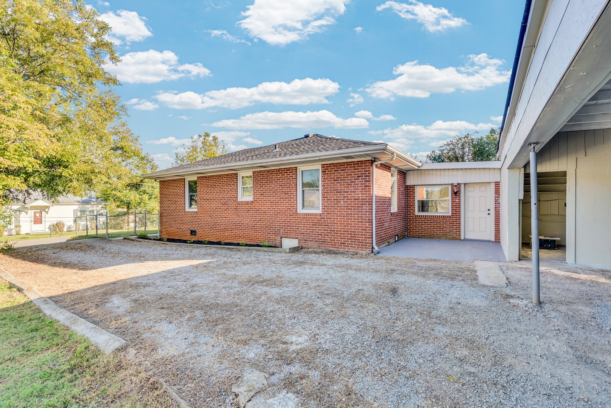 107 Oak Street Sparta, TN 38583 - Photo 23 of 26 a view of a house with backyard and garden