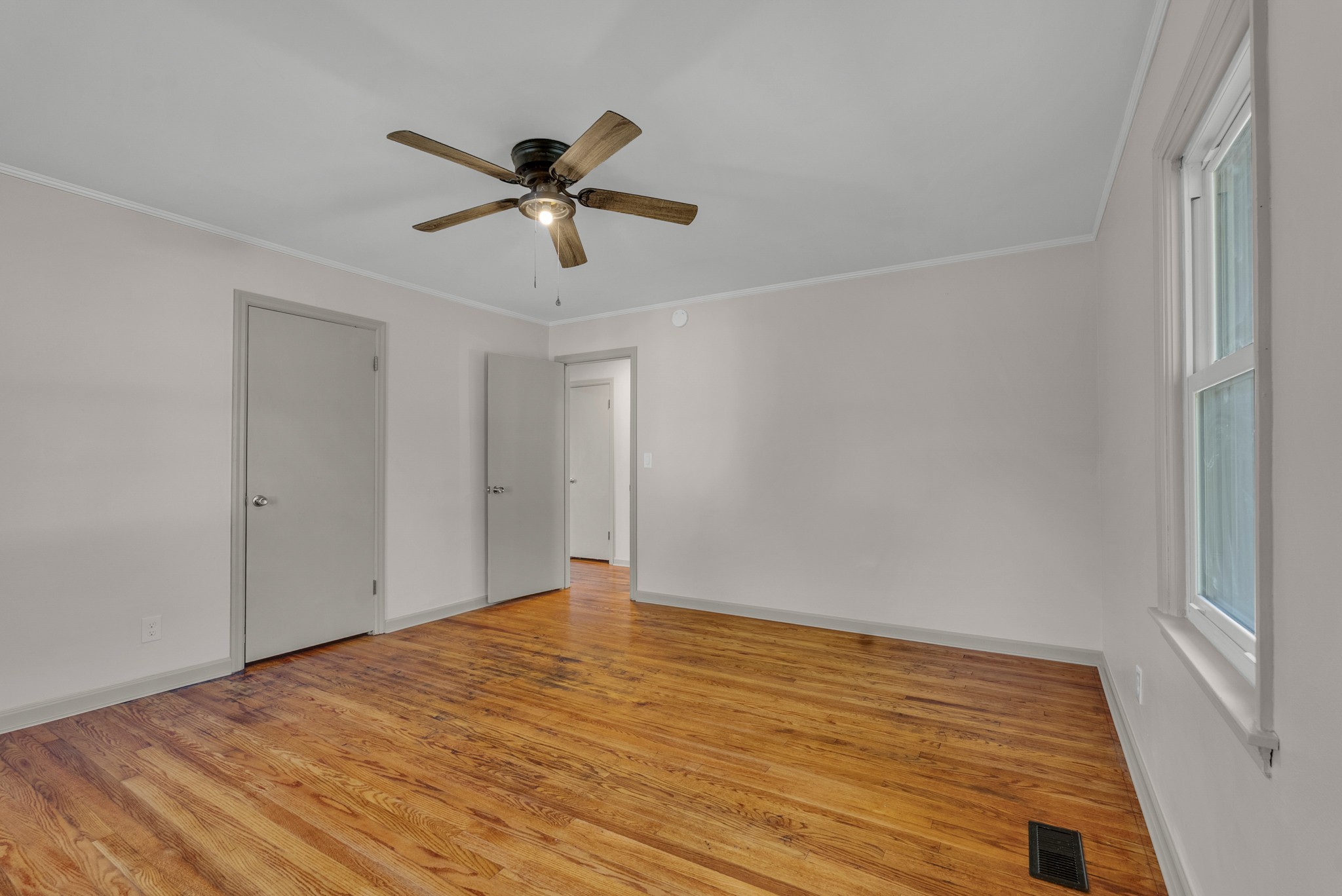 107 Oak Street Sparta, TN 38583 - Photo 10 of 26 a view of empty room with wooden floor and fan