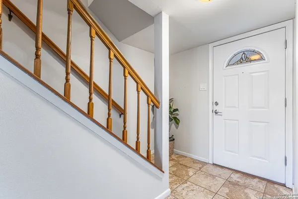 a view of an entryway with wooden floor