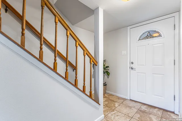 a view of an entryway with wooden floor