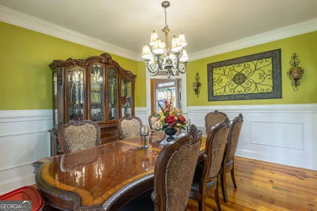 a bedroom with furniture and a chandelier