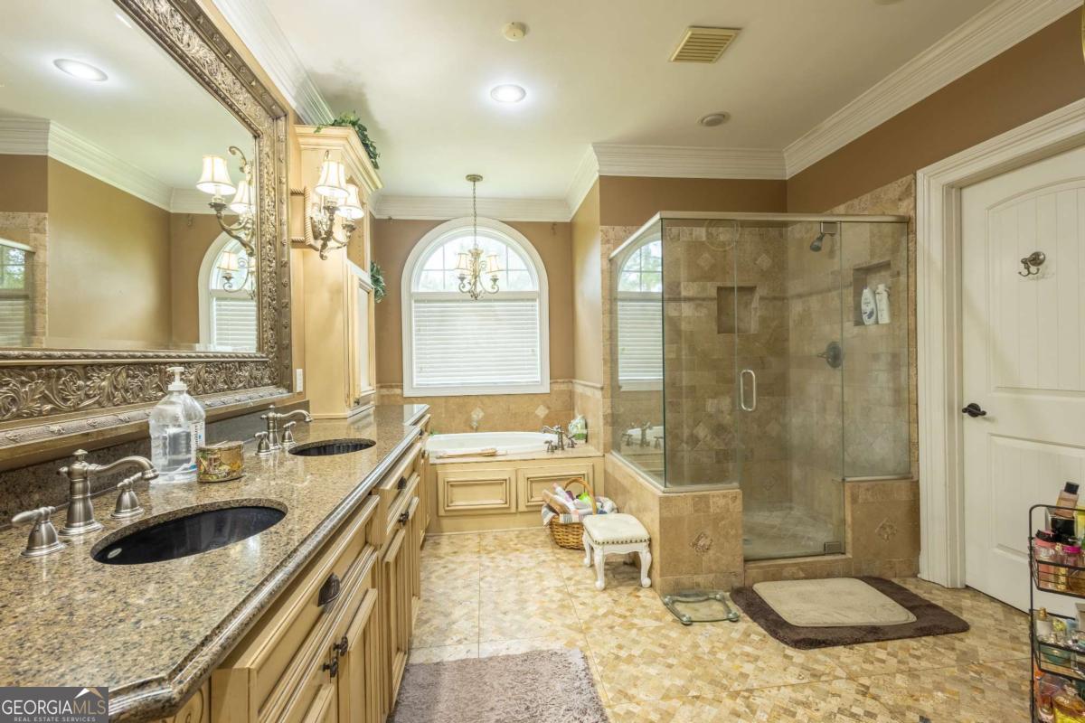 20 Ray Taylor Road Tifton, GA 31793 - Photo 19 of 46 a bathroom with a granite countertop sink mirror and shower
