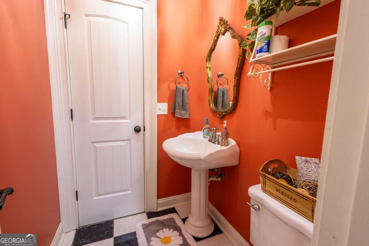 20 Ray Taylor Road Tifton, GA 31793 - Photo 24 of 46 a bathroom with a sink and a mirror