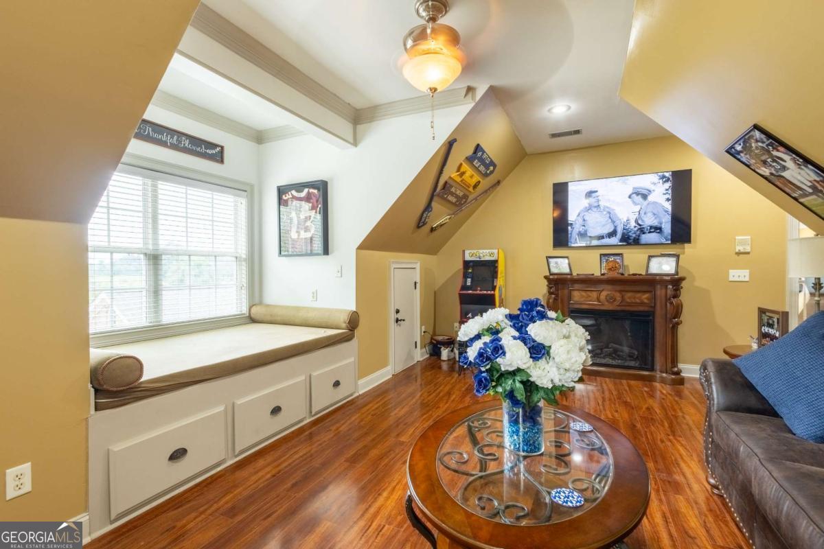 20 Ray Taylor Road Tifton, GA 31793 - Photo 27 of 46 a living room with furniture and a chandelier