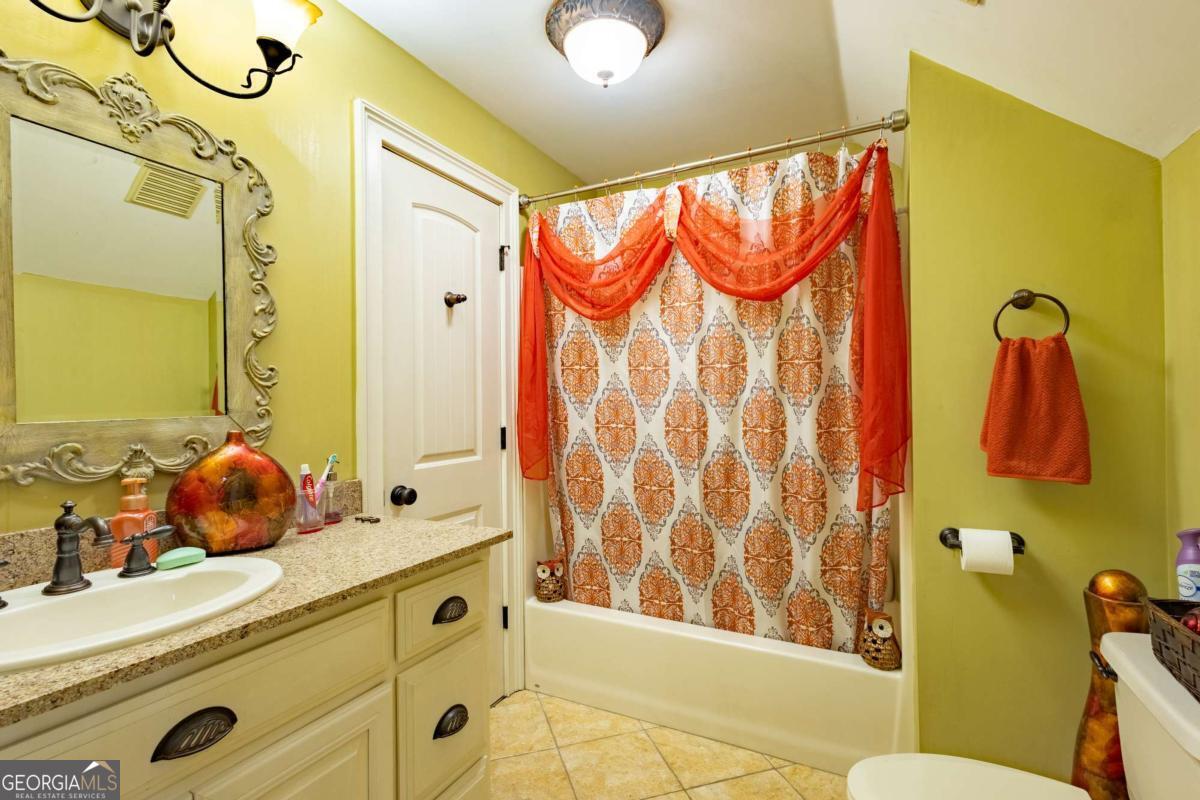 20 Ray Taylor Road Tifton, GA 31793 - Photo 33 of 46 a bathroom with a sink and a mirror
