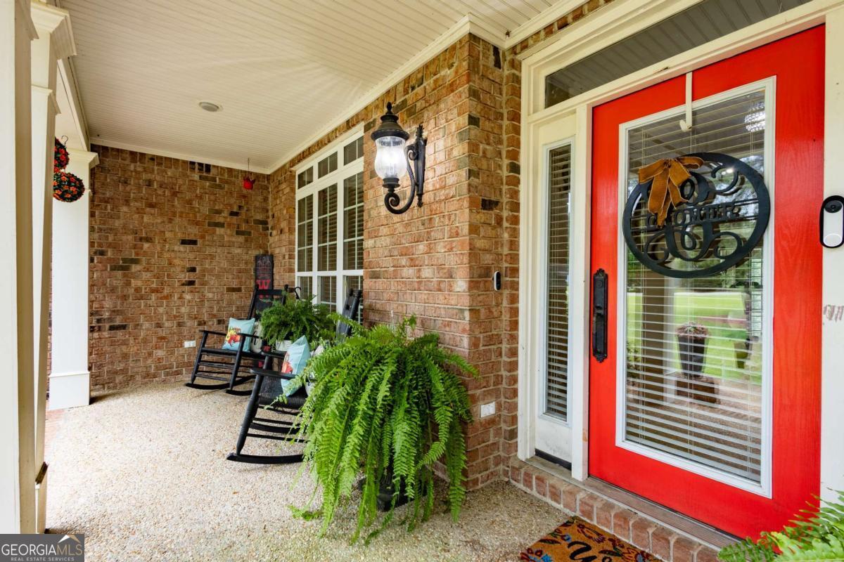 20 Ray Taylor Road Tifton, GA 31793 - Photo 36 of 46 a front view of a house with potted plants