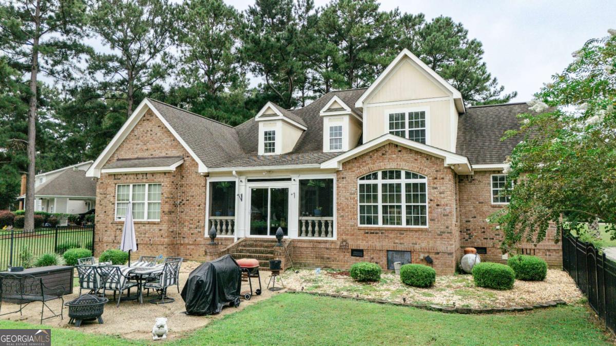 20 Ray Taylor Road Tifton, GA 31793 - Photo 38 of 46 a front view of a house with a yard and potted plants