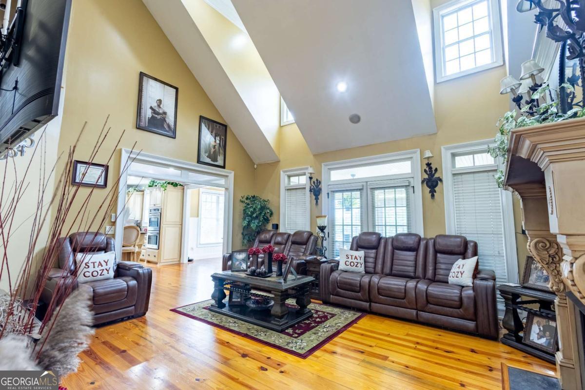 20 Ray Taylor Road Tifton, GA 31793 - Photo 6 of 46 a living room with furniture fireplace and a large window