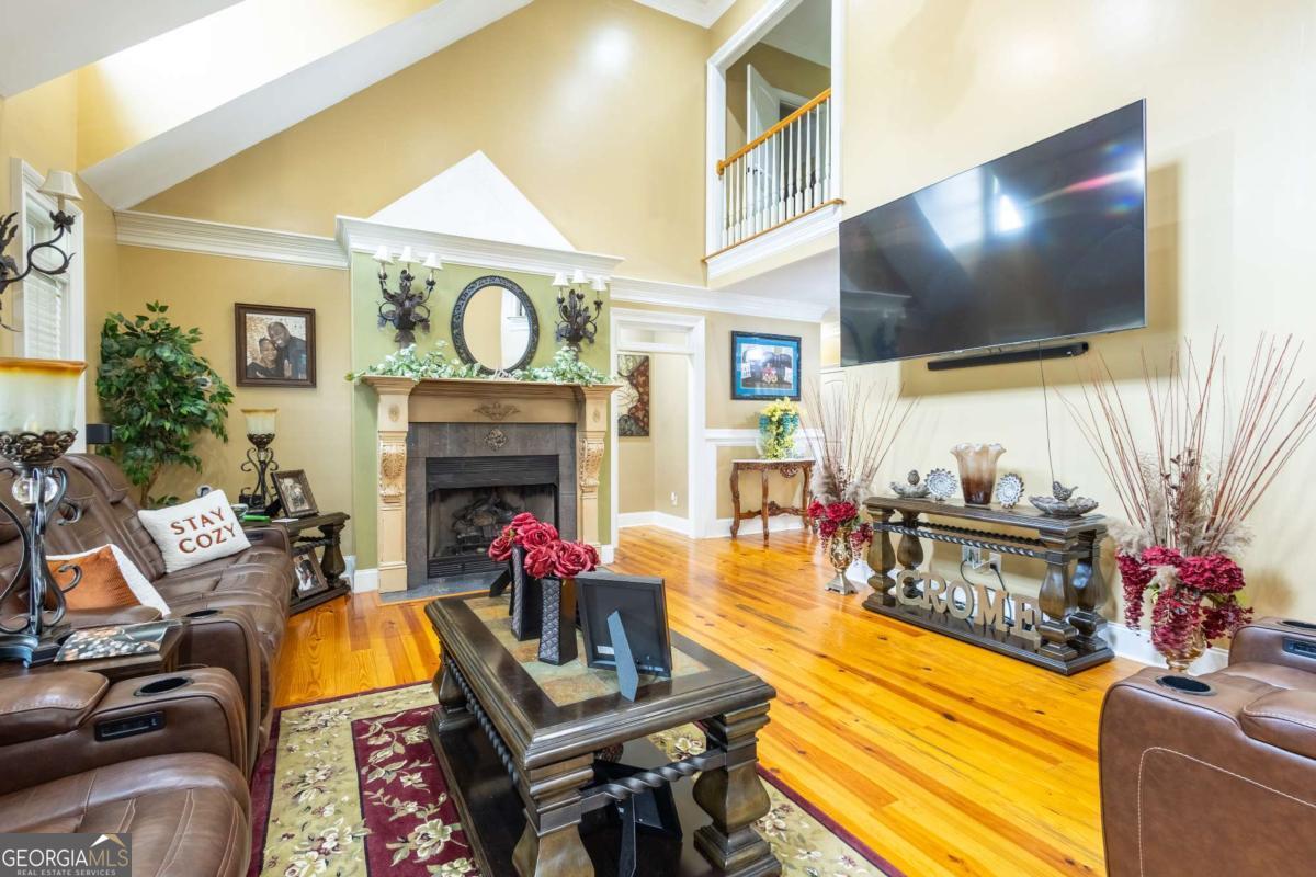 20 Ray Taylor Road Tifton, GA 31793 - Photo 7 of 46 a living room with fireplace furniture and a flat screen tv