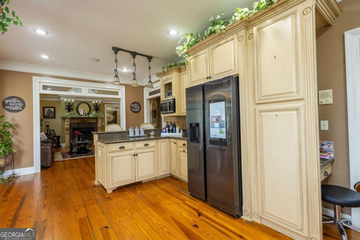 20 Ray Taylor Road Tifton, GA 31793 - Photo 10 of 46 a kitchen with stainless steel appliances granite countertop a refrigerator and a stove top oven