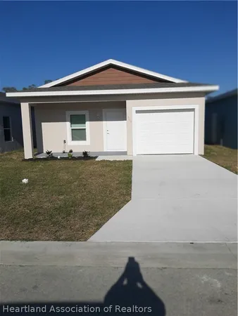 a front view of a house with garage