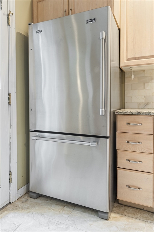 22 Arrowhead Circle, Unit 22 Ashland, MA 01721 - Photo 11 of 35 a white refrigerator freezer sitting in a kitchen