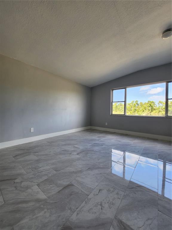 1302 West Shell Point Road Ruskin, FL 33570 - Photo 4 of 10 a view of an empty room and window