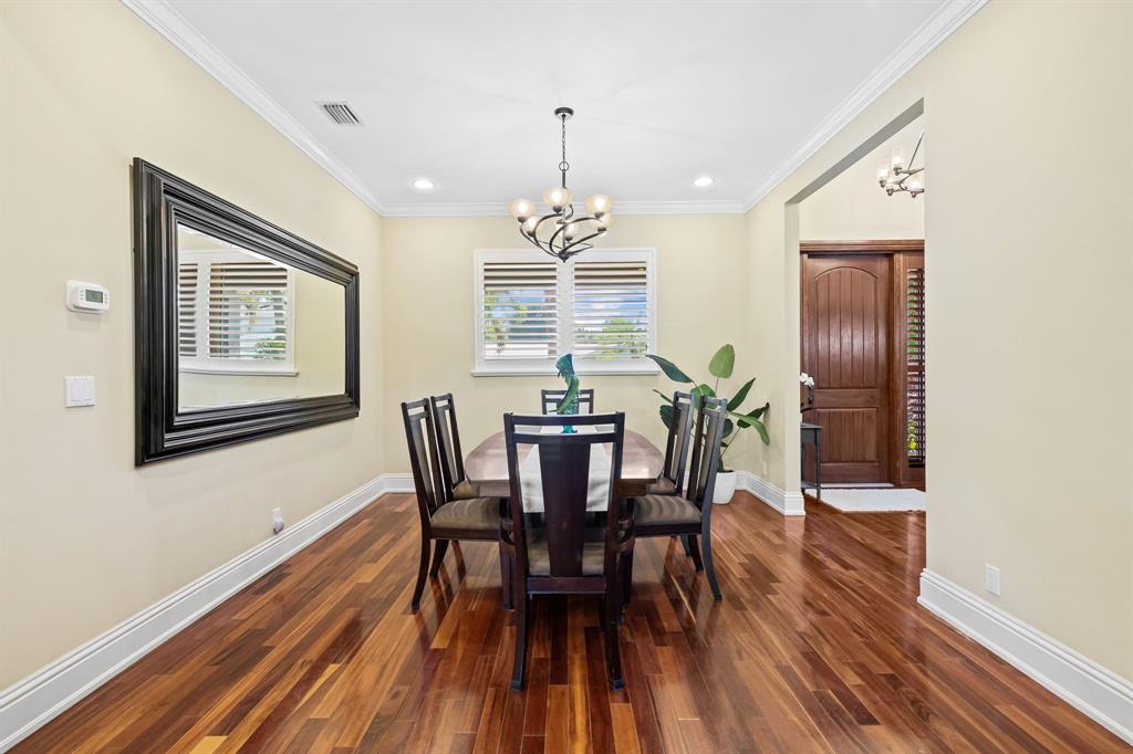 909 Turner Road Delray Beach, FL 33483 - Photo 15 of 50 a view of a dining room with furniture window and wooden floor