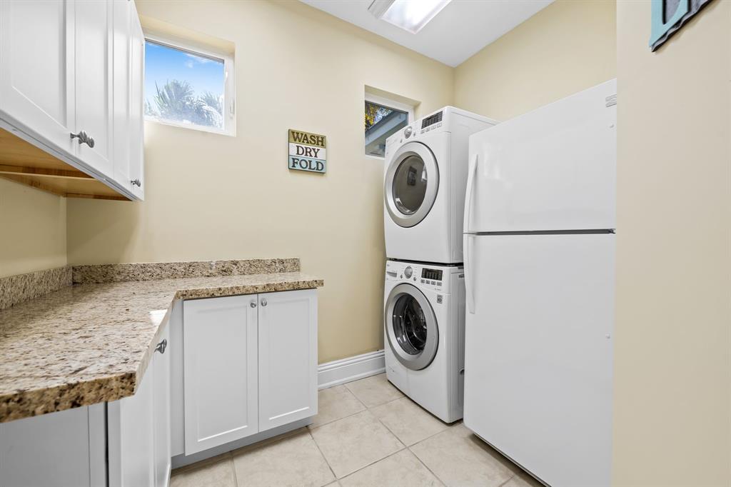 909 Turner Road Delray Beach, FL 33483 - Photo 17 of 50 a utility room with dryer and washer